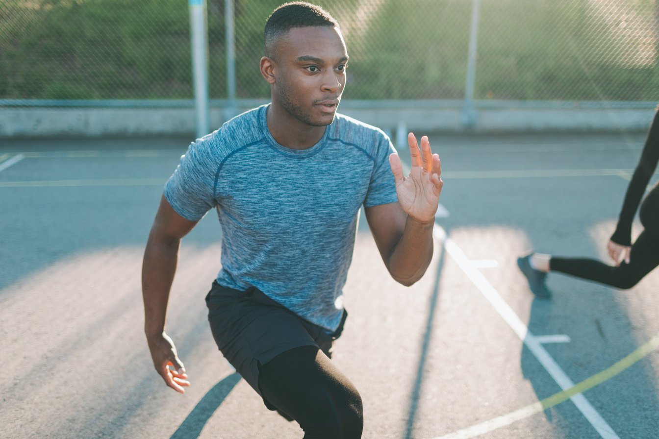 Man in Sportswear Exercising Outdoors